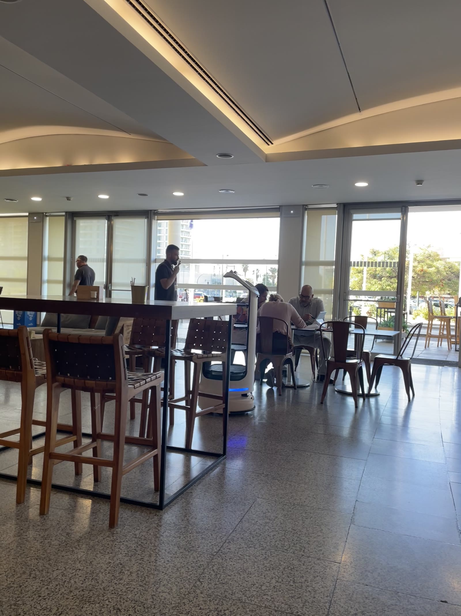 Waiter robot working the cafeteria during everyday service.
